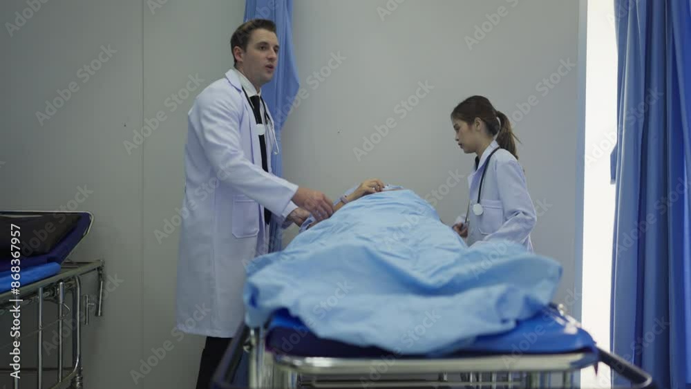 Side view male nurse bring woman patient lie on hospital bed to emergency room then doctor team come to support and treat the patient.