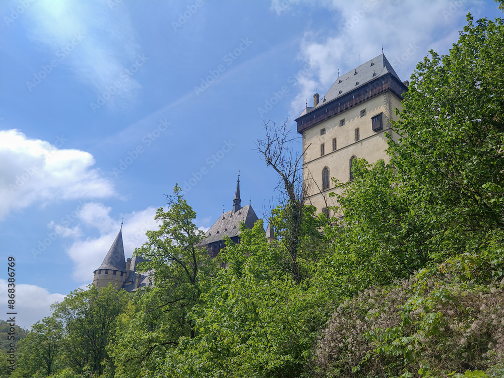 view of Karlstejn Castle against sky on sunny day, Karlstejn, Beroun District, Central Bohemian Region, Czech Republic view of Karlstejn Castle against sky on sunny day, Karlstejn, Beroun District, Central Bohemian Region, Czech Republic