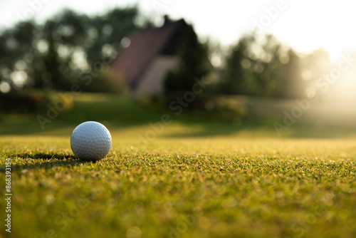 Closeup Golf ball on green grass on course, Sport and lifestyle