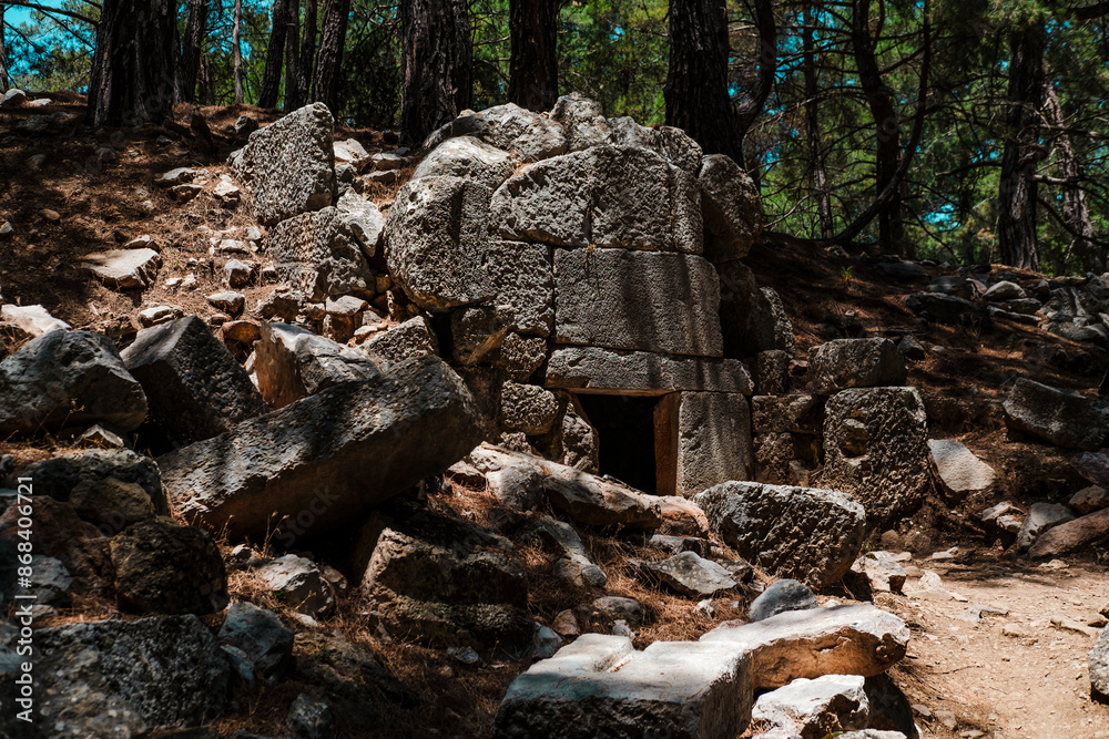 Obraz premium Kadianda or cadyanda antique Lycian town ruins in the forest, stairs, buildings, abandones forest paths, Fethiye open air museum