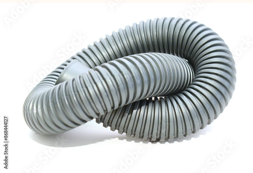 Rolled vacuum cleaner tube - stock photo 