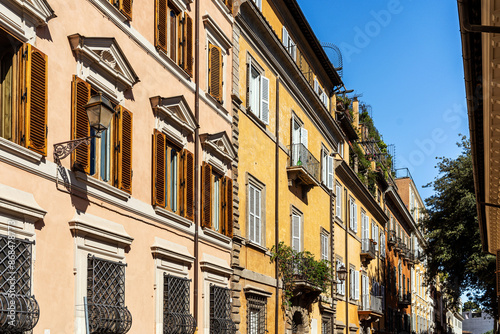 A glimpse of Via Gregoriana with colorful facades and buildings, in Roma city center, Italy photo