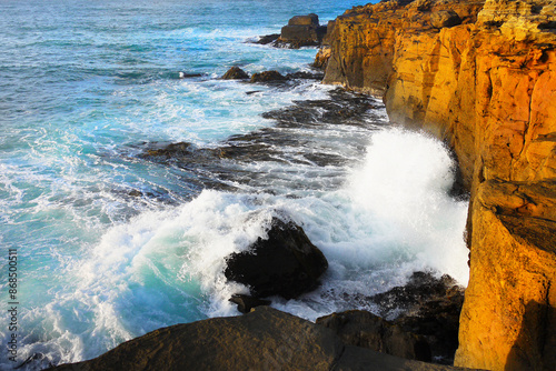 Sea waves crashing on rocks