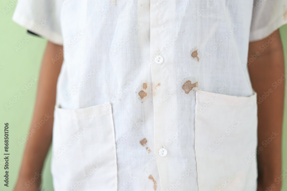 dirty stain on kid shirt from playing in daily life for cleaning cponcept