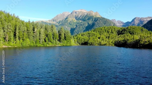 Panoramic view on mountain lake in front of mountain range, national park in Altai republic, Siberia, Russia. Aerial view of scenic mountain road and lake