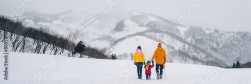 A family is having a great time on a winter vacation in the snowy mountains during the holiday season, enjoying the beautiful landscapes and making unforgettable memories together