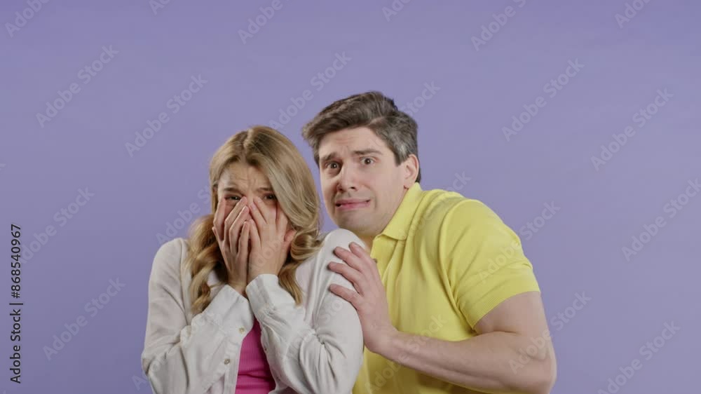 Frightened white american couple afraid of something. Man and woman in shock. Frightened white american couple afraid of something. Man and woman in shock.
