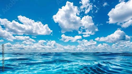Sea water and blue sky with white clouds