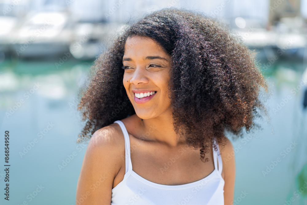 Young African American woman at outdoors With happy expression Young African American woman at outdoors With happy expression