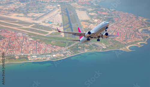 Commerical passenger plane fly up over take-off runway from airport - Istanbul, Turkey