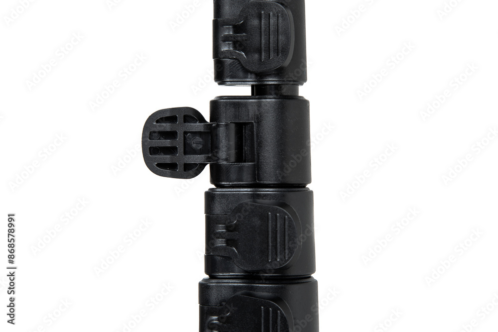 Black mini tripod for compact camera isolated on white back Black mini tripod for compact camera isolated on white back