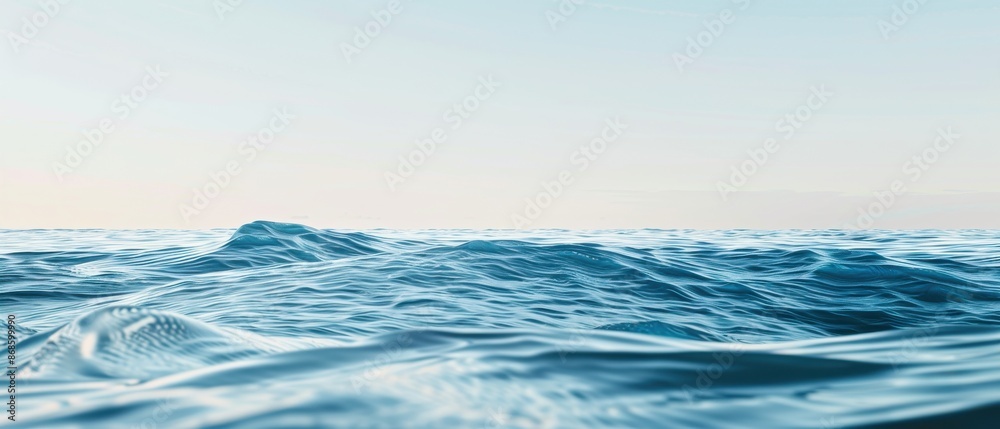 Fototapeta premium The ocean is calm and peaceful, with a few waves breaking on the shore