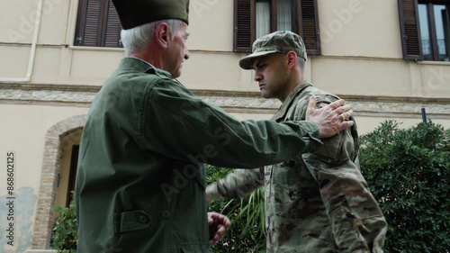 General Instills Valor In American Serviceman With Flag For His Service photo