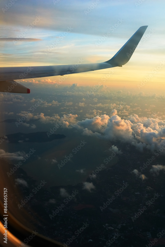 Airplane, clouds and travel with view by window for international flight, commute or immigration. Flying transportation of wing in air, sky or sunset over city for outdoor trip or journey in aircraft Airplane, clouds and travel with view by window for international flight, commute or immigration. Flying transportation of wing in air, sky or sunset over city for outdoor trip or journey in aircraft