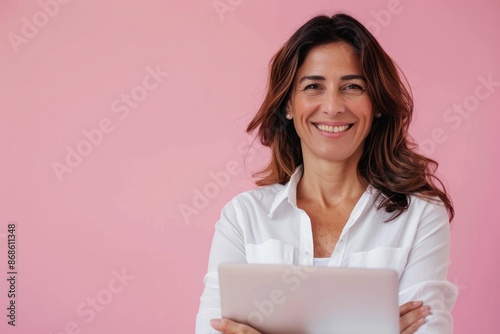 Middle Age Woman Laptop. Beautiful Hispanic Senior Business Woman Working on Laptop Over Pink Background