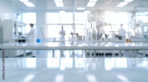 Wallpaper Mural Modern laboratory background with empty table. Blurred lab interior with scientists working in background, providing clean space for product placement. Torontodigital.ca