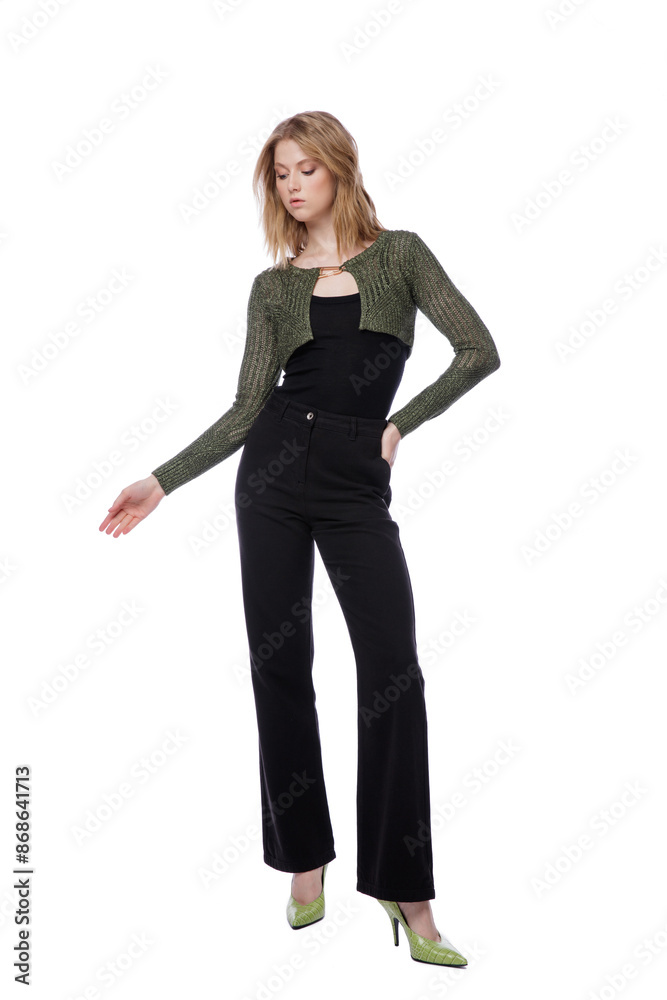 High fashion photo of a beautiful elegant young woman in pretty black denim pants, trousers, top, green short jacket posing on white background. Slim figure. Blonde High fashion photo of a beautiful elegant young woman in pretty black denim pants, trousers, top, green short jacket posing on white background. Slim figure. Blonde