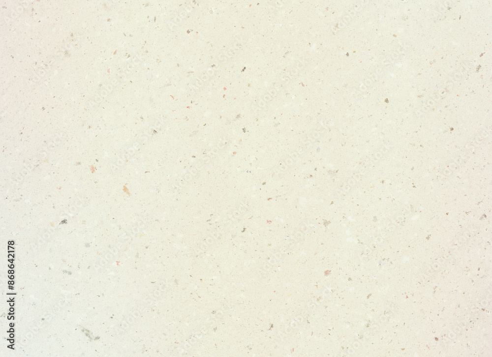 Ecru handmade paper. It contains fragments of other paper. Meant as background Ecru handmade paper. It contains fragments of other paper. Meant as background