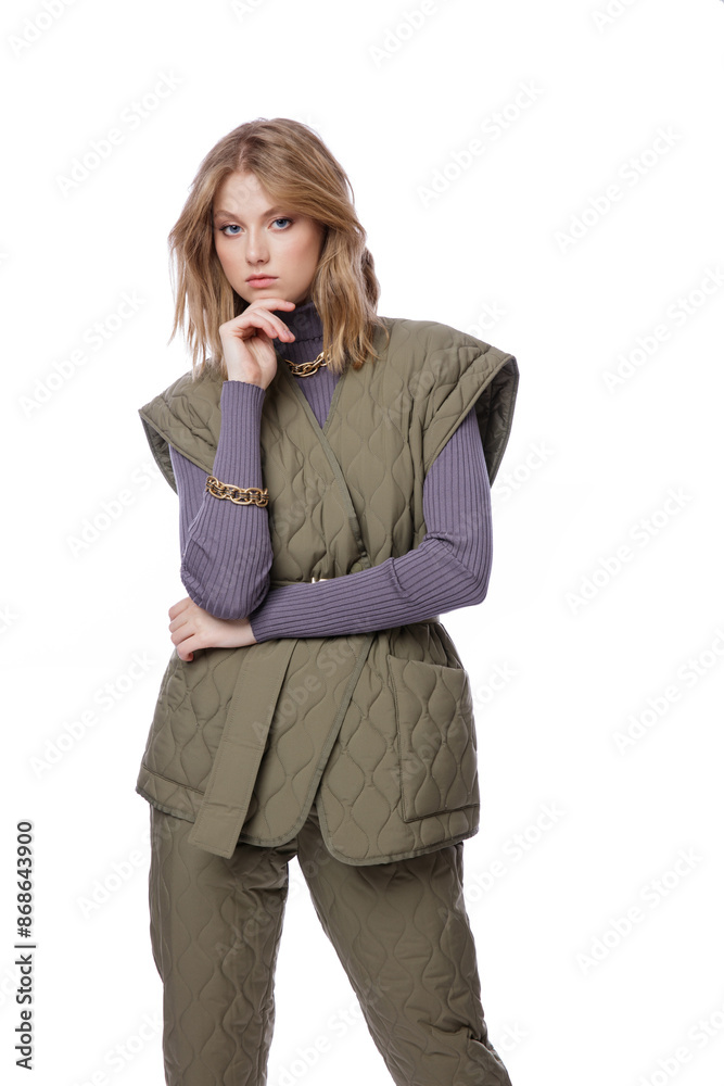 High fashion photo of a beautiful elegant young woman in pretty green pants, trousers, purple blouse, jacket posing on white background. Slim figure. Blonde High fashion photo of a beautiful elegant young woman in pretty green pants, trousers, purple blouse, jacket posing on white background. Slim figure. Blonde