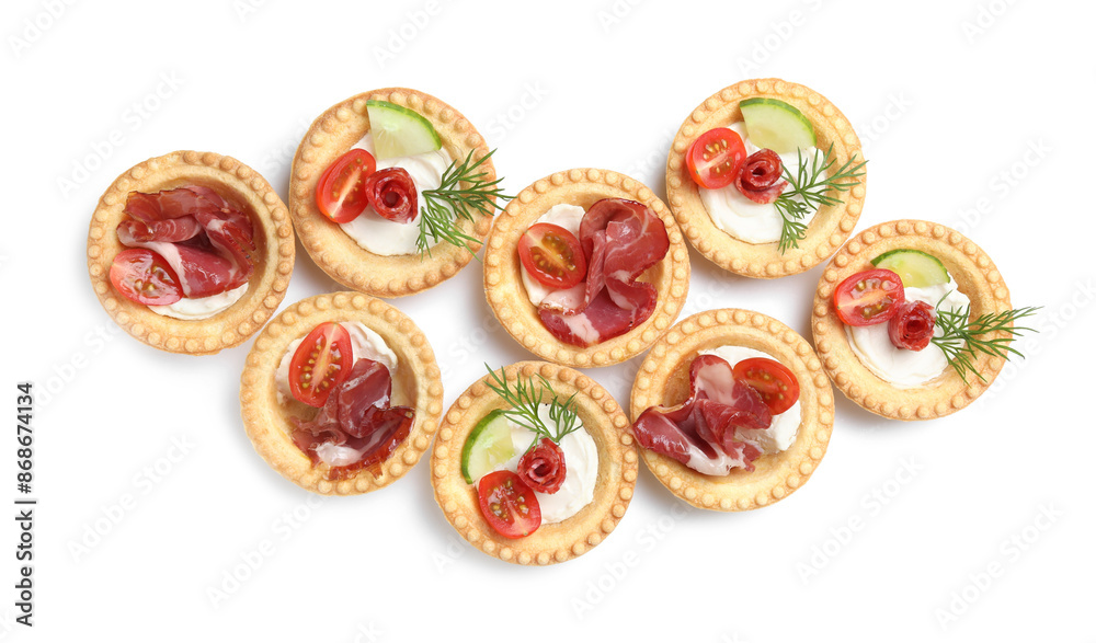 Delicious canapes with jamon, dry smoked sausages and vegetables isolated on white, top view Delicious canapes with jamon, dry smoked sausages and vegetables isolated on white, top view