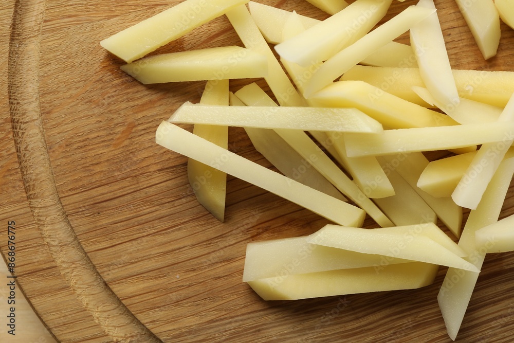 Cut fresh raw potatoes on table, top view Cut fresh raw potatoes on table, top view