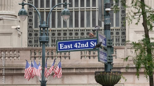 New York City Grand Central Terminal, 42 street, Park Avenue, Pershing Square architecture. Midtown district railroad hub, railway transport. NY crossroad corner, intersection road sign, american flag photo