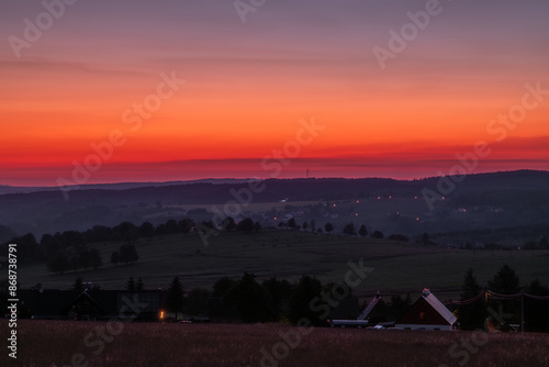 Sunset in solstice long day in Nova Ves v Horach village in hot summer evening photo