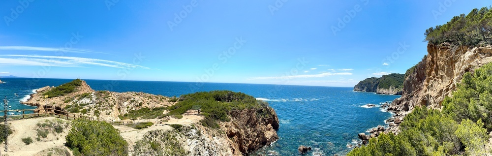 panoramic view of the Cala s'Eixugador outcrop and the rocky coastline with high cliff at the Costa Brava at the Mediterranean Sea, Catalonia, Costa Brava, Girona, Spain