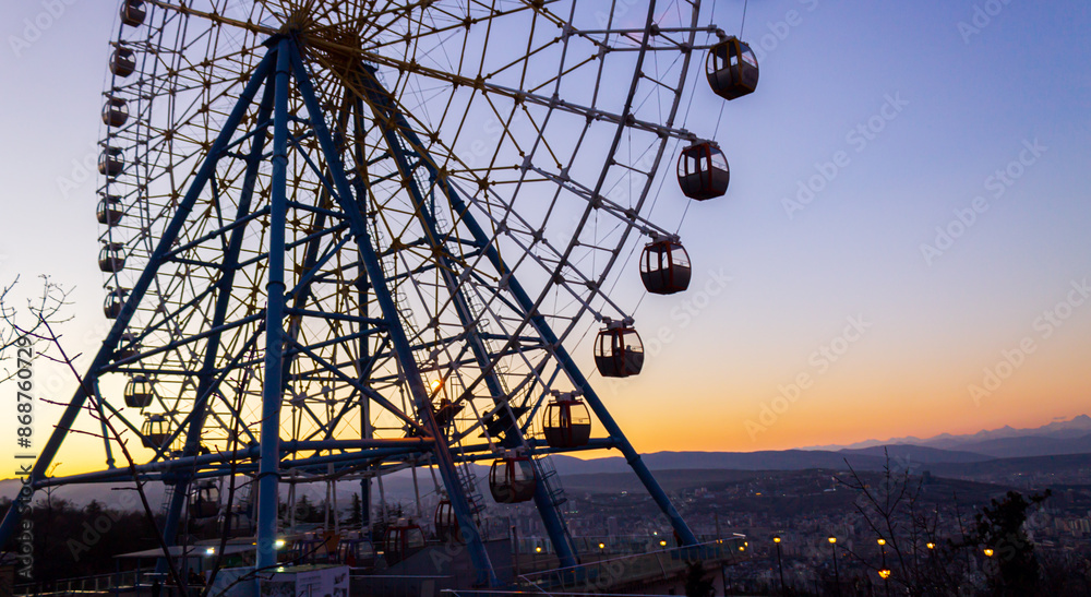 View of the Ferris wheel in Mtatsminda park, Georgia, Tbilisi View of the Ferris wheel in Mtatsminda park, Georgia, Tbilisi