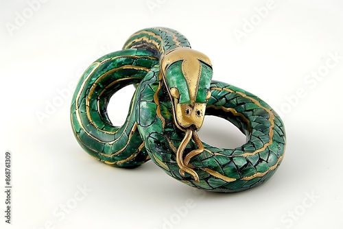 A talisman that is a coiled serpent, made of emerald and gold photo