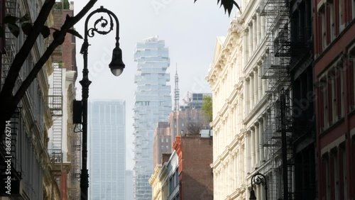 New York City Manhattan Soho fashion district near Broadway street. USA urban building facade, old american architecture. Shopping in NYC, United States. Business and residential real estate. Lantern