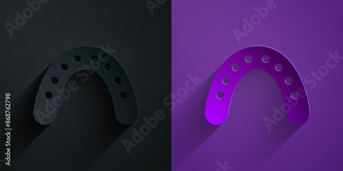 Paper cut Mouth guard boxer icon isolated on black on purple background. Paper art style. Vector