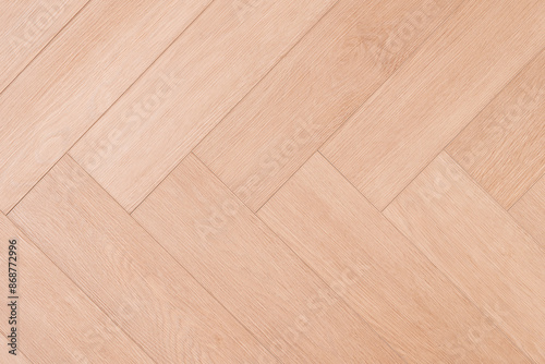 A wooden background with brown stripes. The stripes are thin and evenly spaced, wooden texture background © Aleksandr Matveev