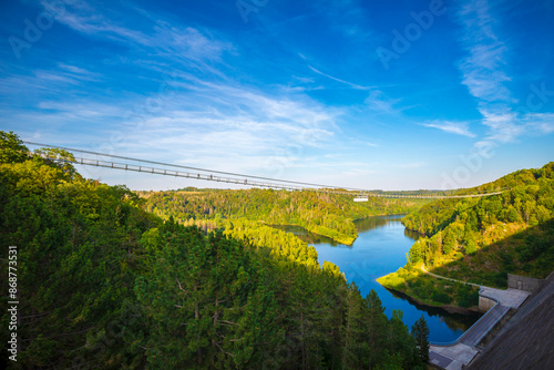 Pedestrian suspension bridge above Rappbodetalsperre lake and Rappbode River in Harz Mountains National Park, Germany photo