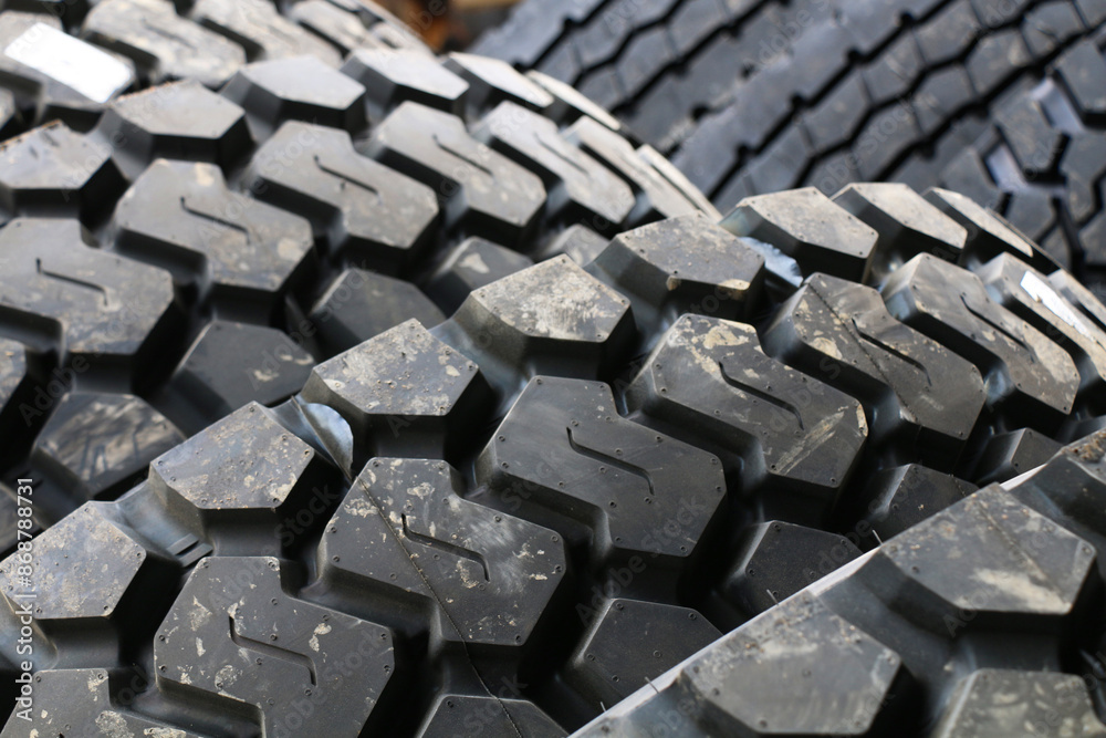 new car tires lined up for installation on cars and trucks new car tires lined up for installation on cars and trucks