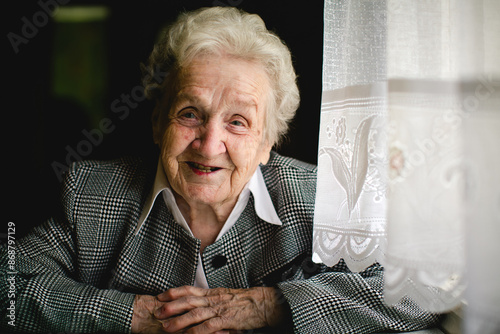 Fotografie A portrait of an elderly lady in her home.