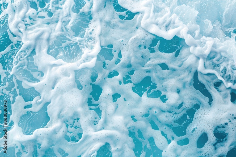 A close-up shot of foamy water on an ocean wave A close-up shot of foamy water on an ocean wave