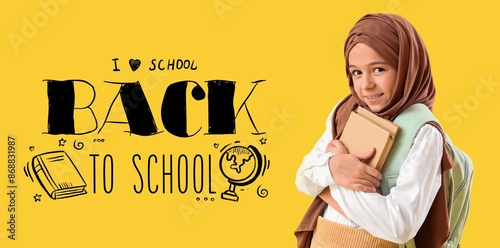 Little Muslim girl with bac...