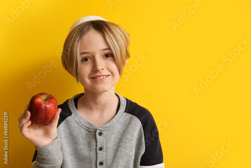 Cute little boy with apple ...