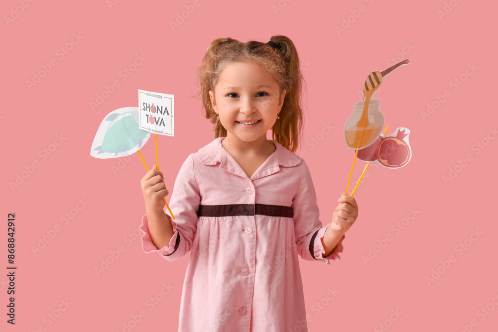 Cute little girl with decorations for Rosh Hashanah (Jewish New Year) celebration on green background Cute little girl with decorations for Rosh Hashanah (Jewish New Year) celebration on green background