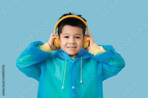 Cute little Asian boy in ra...
