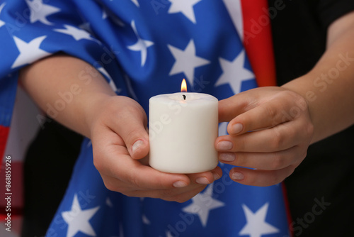 Woman with flag of USA hold...