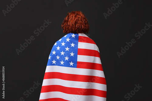 Woman with flag of USA on d...