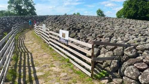 Entrance to Kings grave, a 75-meter-diameter Bronze Age cairn containing a coffin with ten stone slabs with carved figures, in Kivik, Simrishamn Municipality, Skåne County, Sweden, Scandinavia, Europe photo