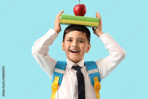 Little schoolboy with apple...