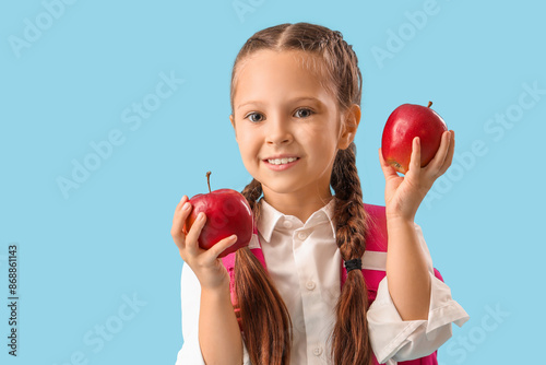 Little schoolgirl with appl...