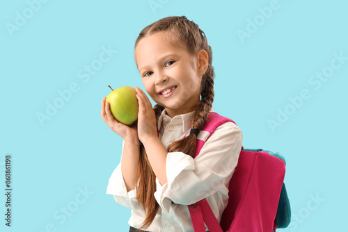 Little schoolgirl with appl...