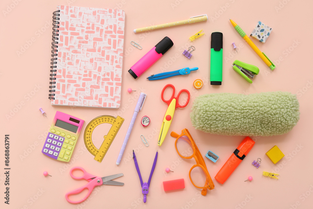 School supplies with scissors, markers and pencil case on beige background. Top view School supplies with scissors, markers and pencil case on beige background. Top view