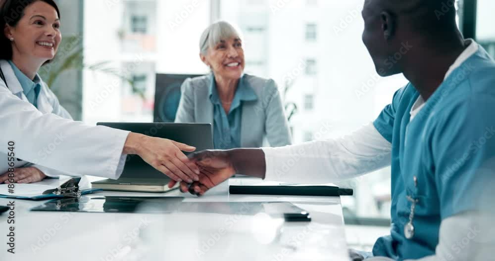 Doctors, people and shaking hands for agreement, partnership or healthcare deal in hospital. Medical, happy team or handshake for collaboration, cooperation or thank you in meeting together at clinic Doctors, people and shaking hands for agreement, partnership or healthcare deal in hospital. Medical, happy team or handshake for collaboration, cooperation or thank you in meeting together at clinic