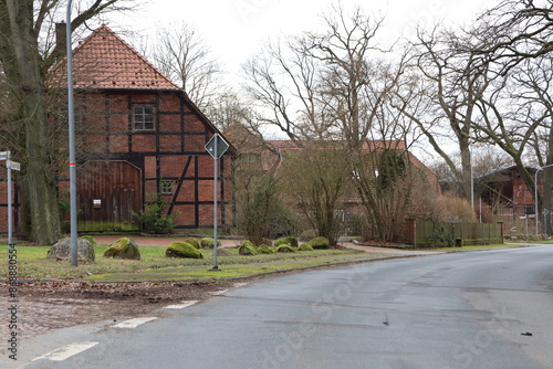 European village with timberframed houses, historic architecture, and picturesque countryside